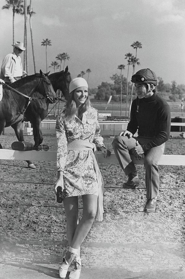 Cheryl Tiegs With Jockey Laffit Pincay Photograph by Henry Clarke