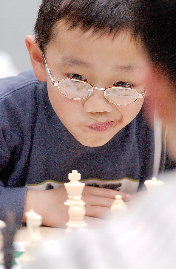 Chess Kid Ponders Photograph by Steve Somerville