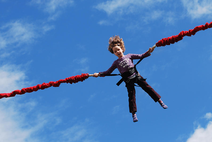 Child bungee jumping Photograph by Lilia Petkova
