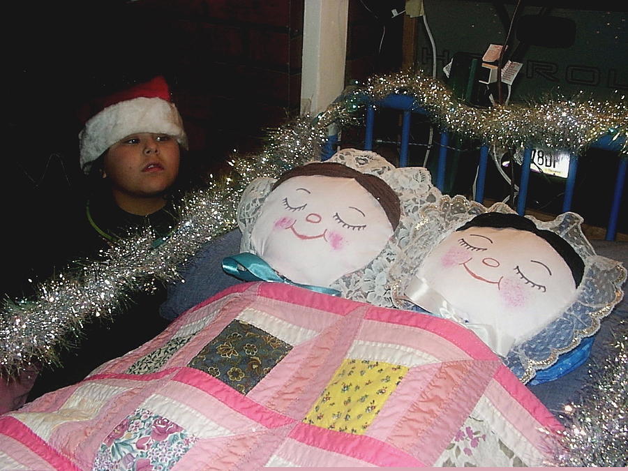 Child in Santa hat with dolls in bed Xmas parade Eloy Arizona 2001 Photograph by David Lee Guss