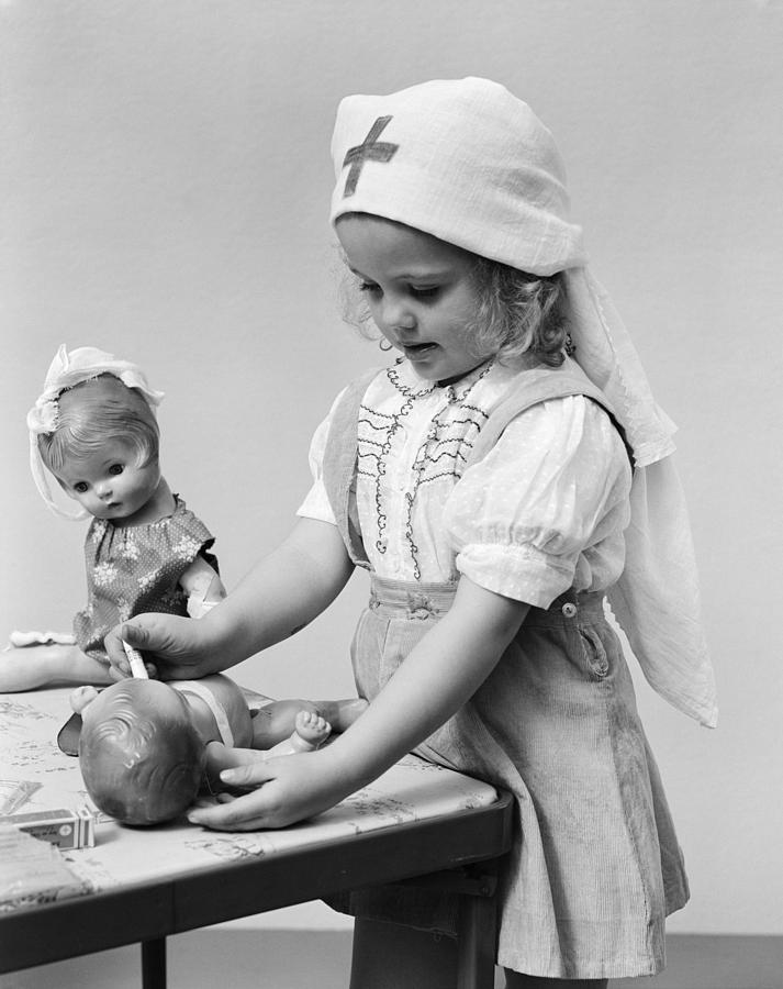 Child Playing Doctor With Dolls, C.1940s Photograph by H. Armstrong Roberts/ClassicStock