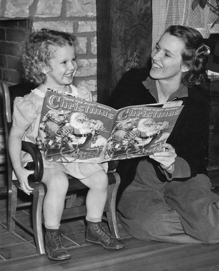 Christmas Photograph - Child Reading A Christmas Book by E. Earl Curtis