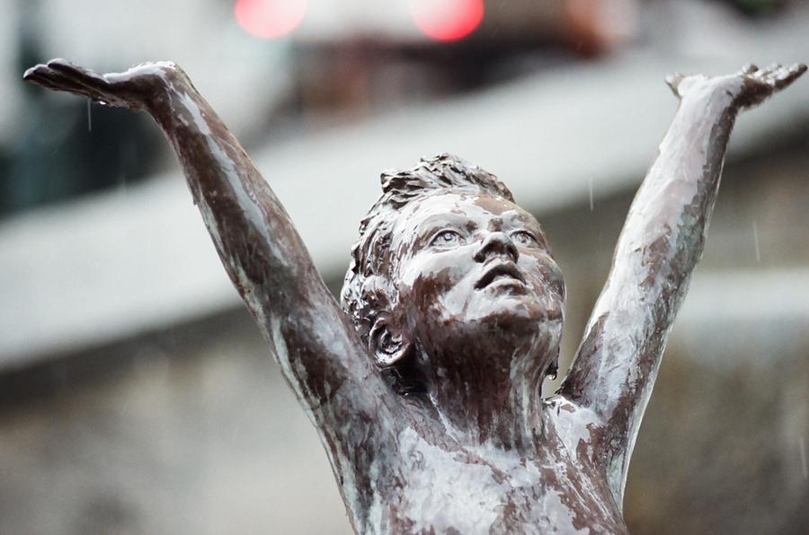 Child Statue in the Rain Photograph by Retro Images Archive