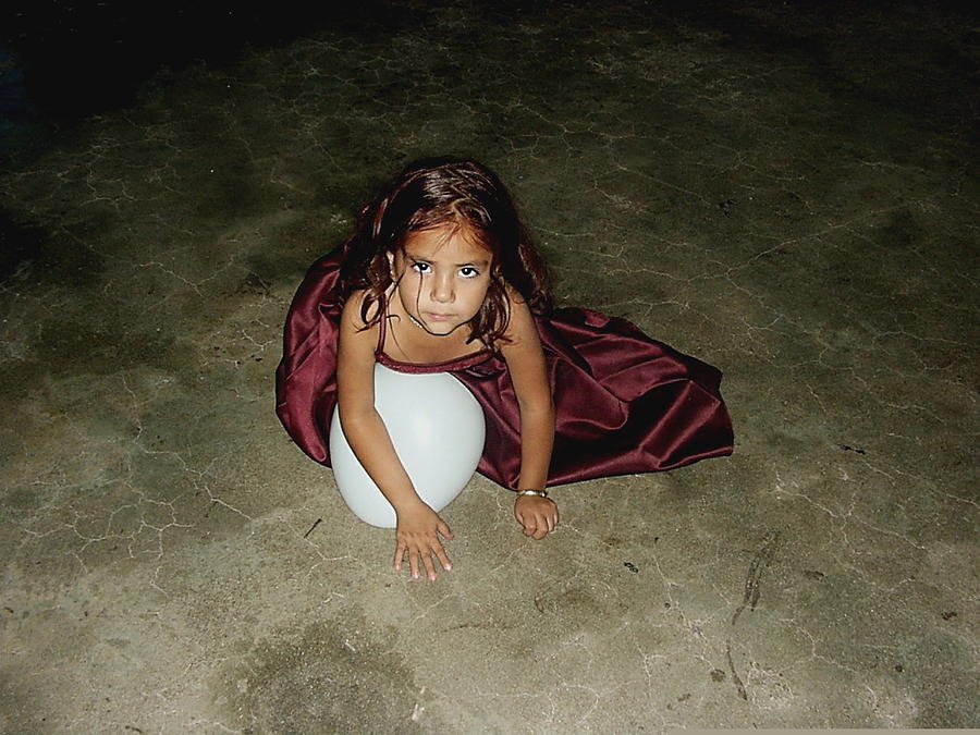 Child with balloon Lorena Ortizs quinceanera Eloy Arizona 2001  Photograph by David Lee Guss