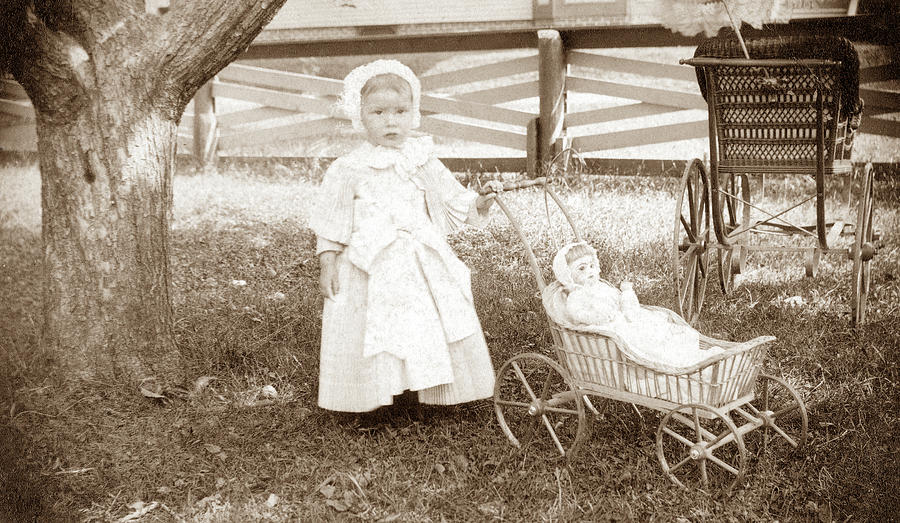 Child With Doll/carriage Photograph by Granger