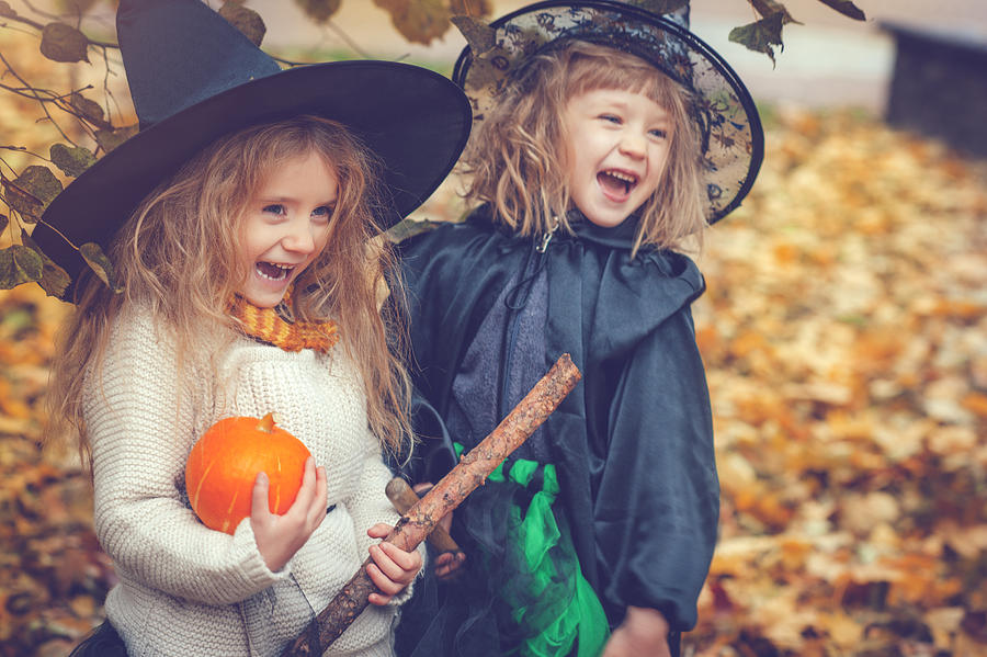 Children celebrating Halloween Photograph by ArtMarie