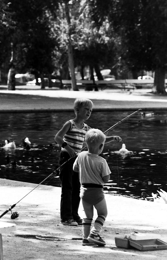 Children fishing Photograph by Karl Rose