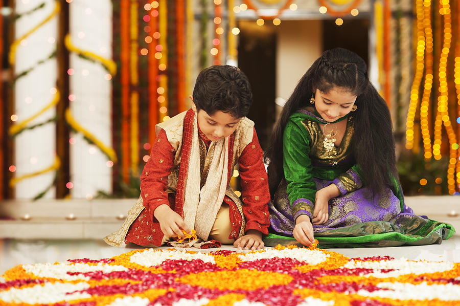Children making rangoli on Diwali Photograph by Uniquely India