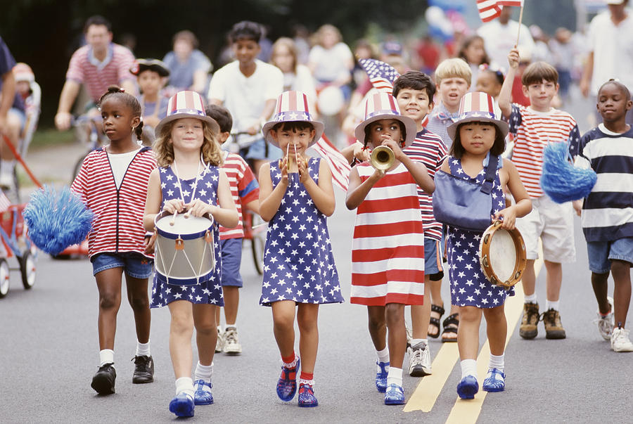 Children marching in 4th of July parade Photograph by Ariel Skelley