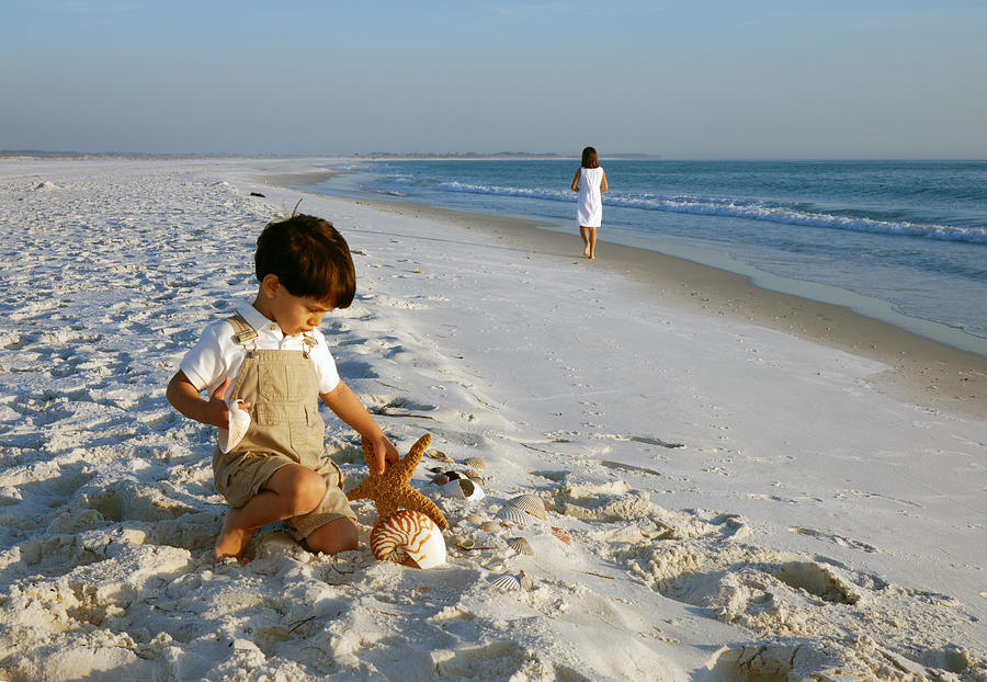 Children on the beach Photograph by Choicegraphx