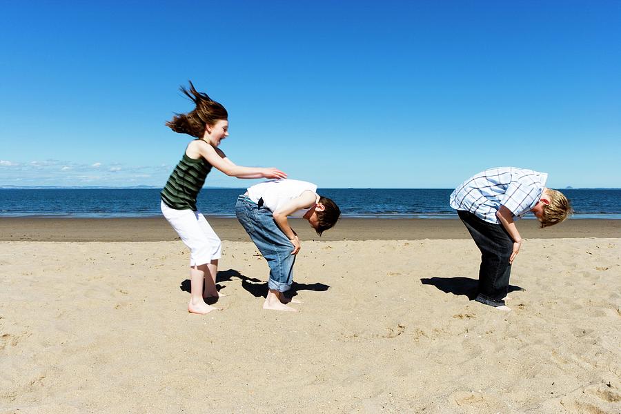 Children Playing Leapfrog Photograph by Gustoimages/science Photo ...