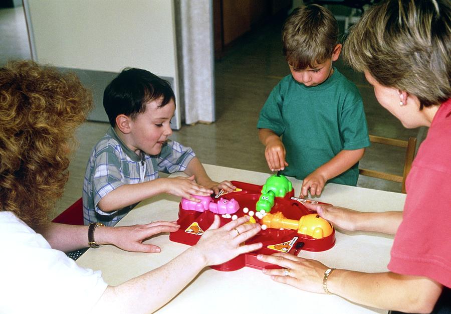 Children Playing With Toy In Occupational Therapy Photograph by Antonia Reeve/science Photo Library