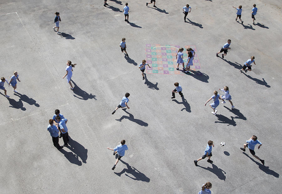 Children Running On Playground Photograph by Dan Kenyon