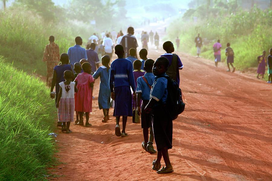 Children Walking Along A Road Photograph by Mauro Fermariello/science Photo Library