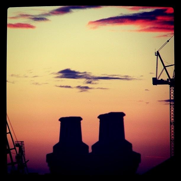 Sunset Photograph - Chimney Pots and Cranes by James McCartney