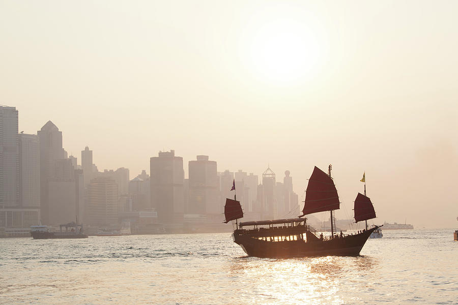 Chinese Junk Sail At Sunset In Hong Photograph by Matteo Colombo