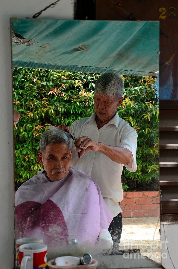 Mug Photograph - Chinese street side barber cuts client hair Singapore by Imran Ahmed