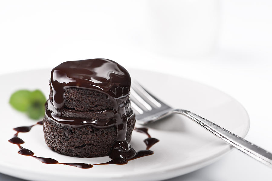 Chocolate cake with melted chocolate on top Photograph by NightAndDayImages