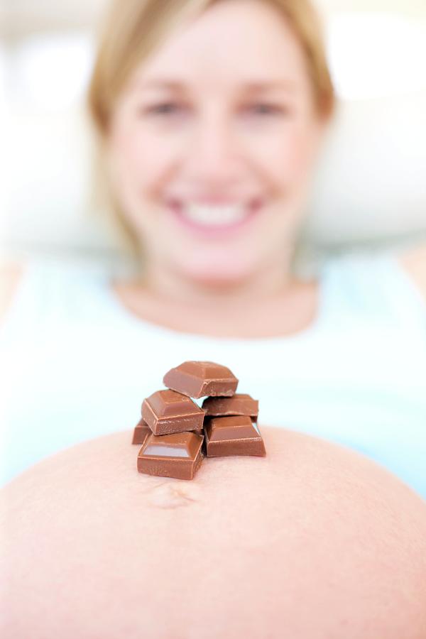 Chocolate On A Pregnant Womans Abdomen Photograph by Ian Hooton/science Photo Library