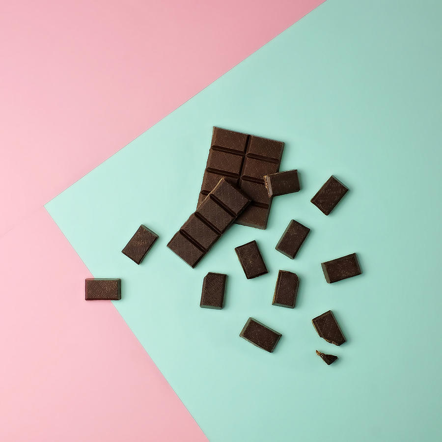 Chocolate pieces on color block background Photograph by Juj Winn