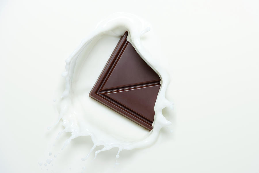 Chocolate Splashing In To Milk Photograph by Chris Stein