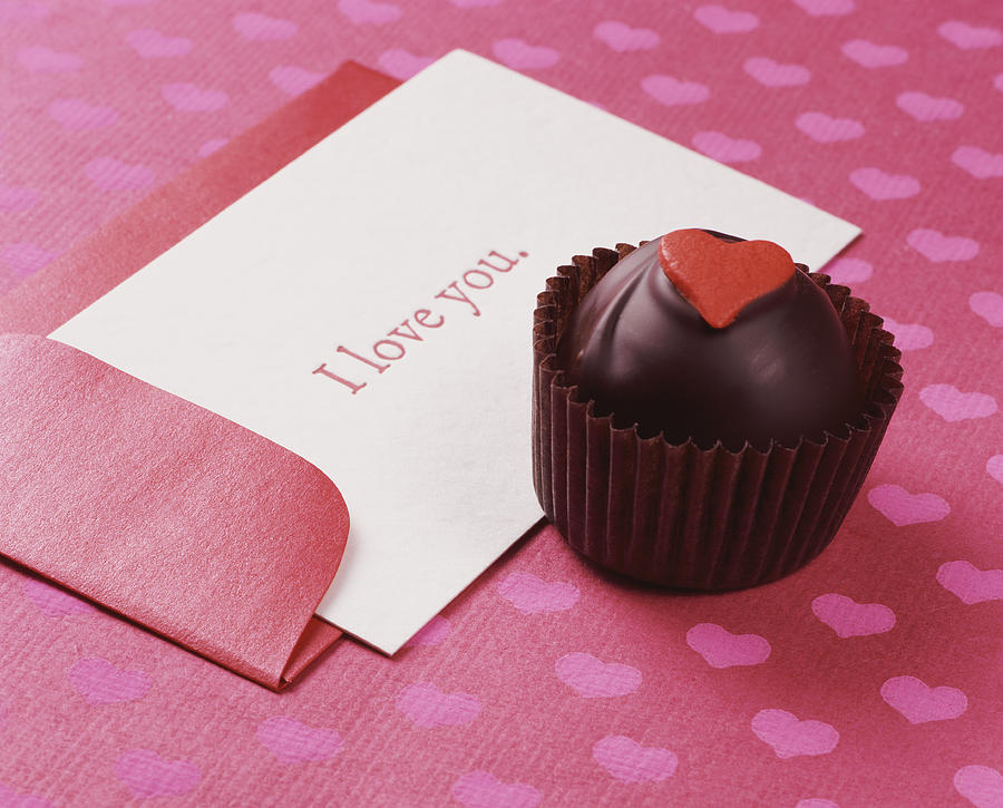 Chocolate Truffle With a Card Saying I Love You Photograph by Digital Vision.
