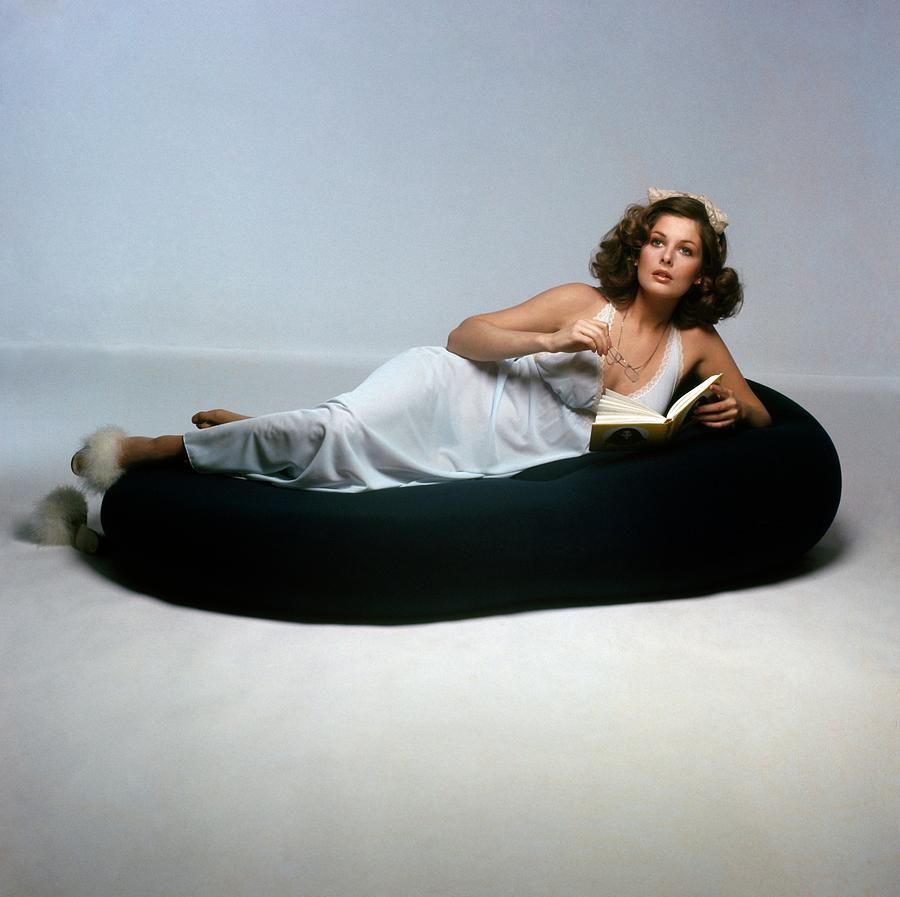 Christina Ferrare Lying On A Knoll International Photograph by Francesco Scavullo