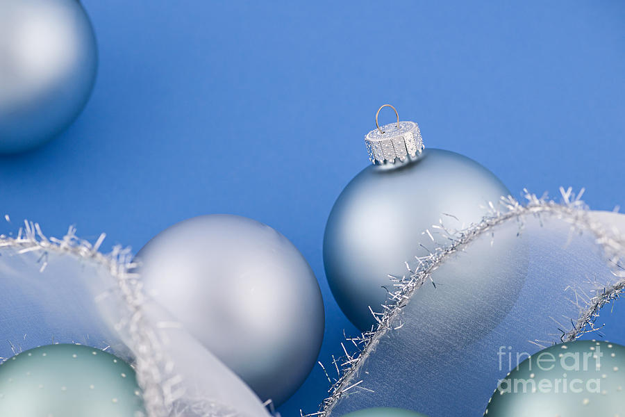 Christmas Photograph - Christmas baubles on blue 2 by Elena Elisseeva