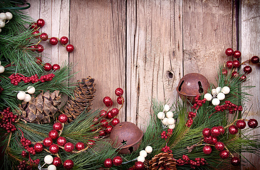Christmas Photograph - Christmas berries on wooden background by Jennifer Huls