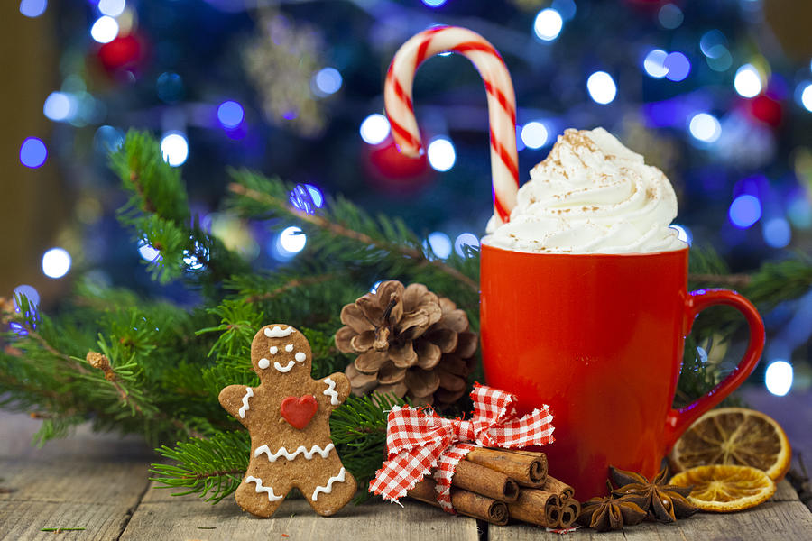 Christmas cappuccino and gingerbread cookies infront Christmas tree Photograph by Eli_asenova