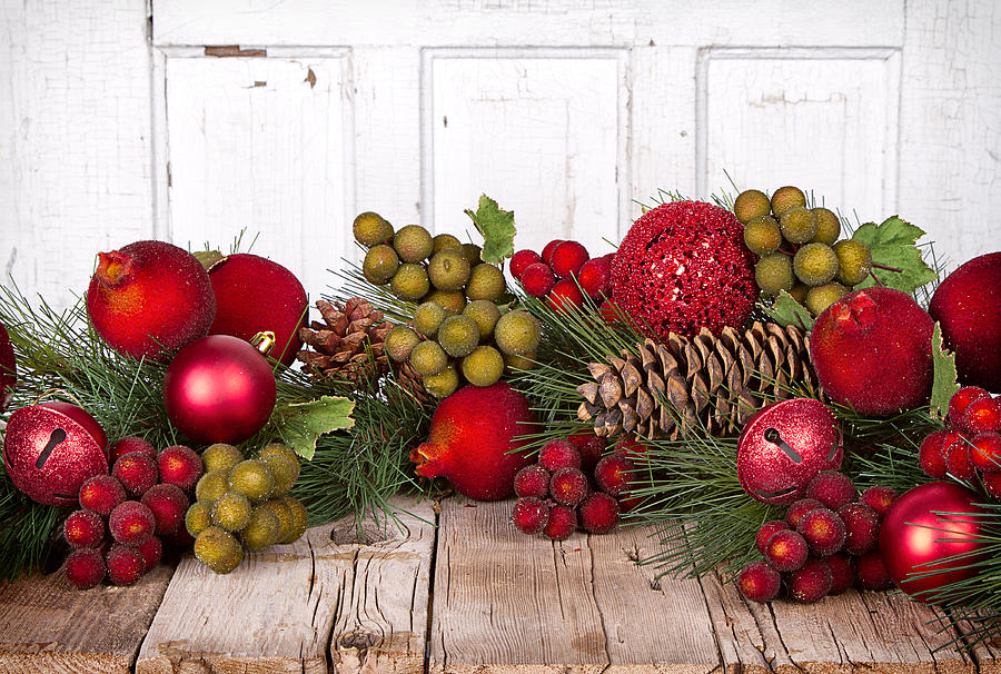 Christmas Photograph - Christmas fruit on a wooden background by Jennifer Huls