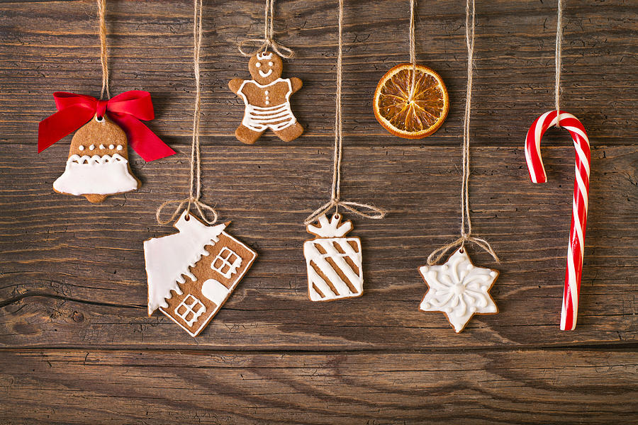 Christmas gingerbread cookies on wood background Photograph by Eli_asenova