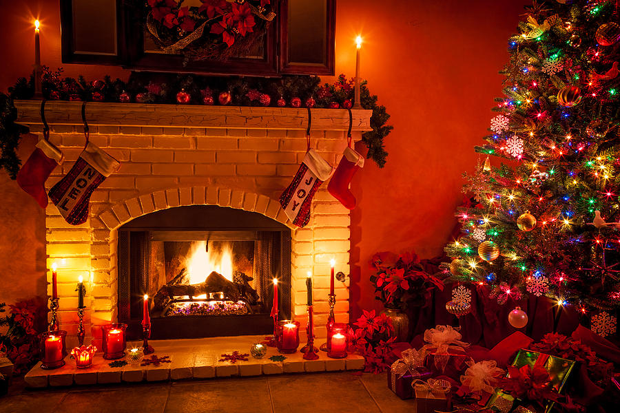Christmas living room with fireplace and presents under tree (P) Photograph by Ron and Patty Thomas