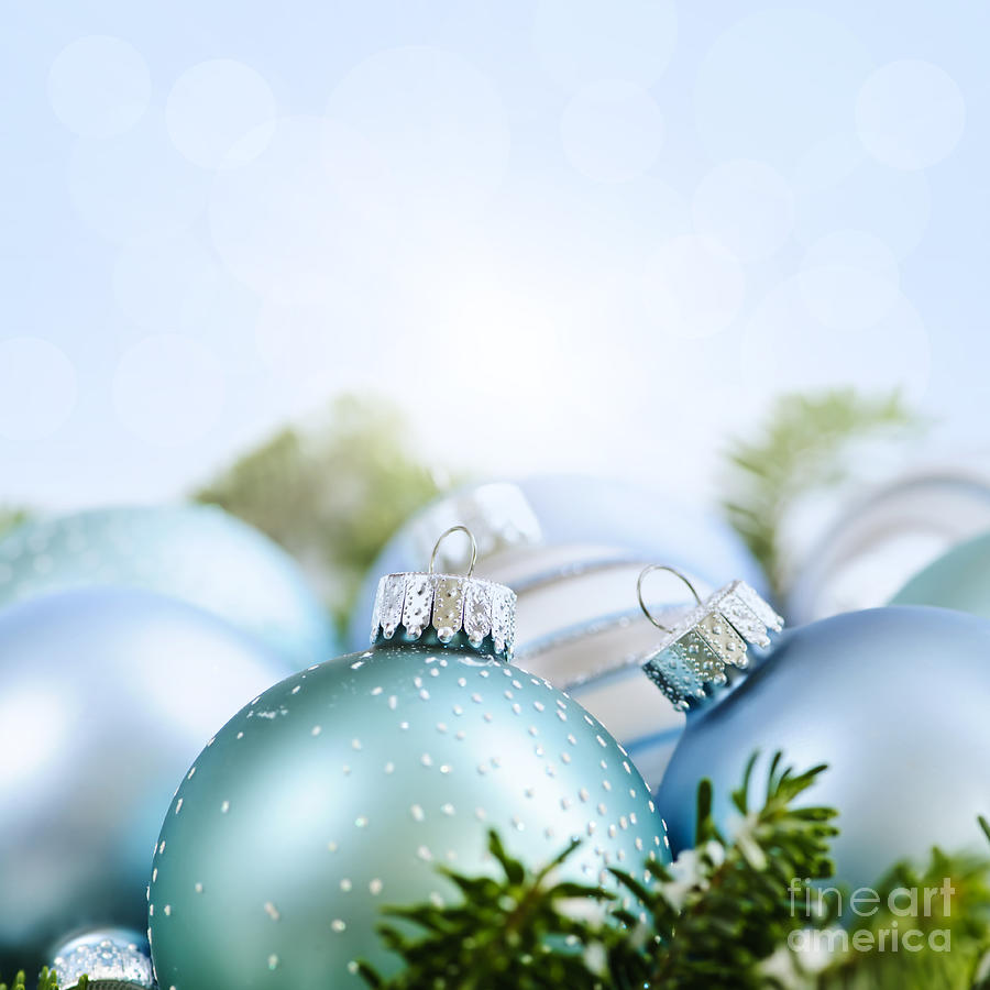 Christmas Photograph - Christmas ornaments on blue by Elena Elisseeva