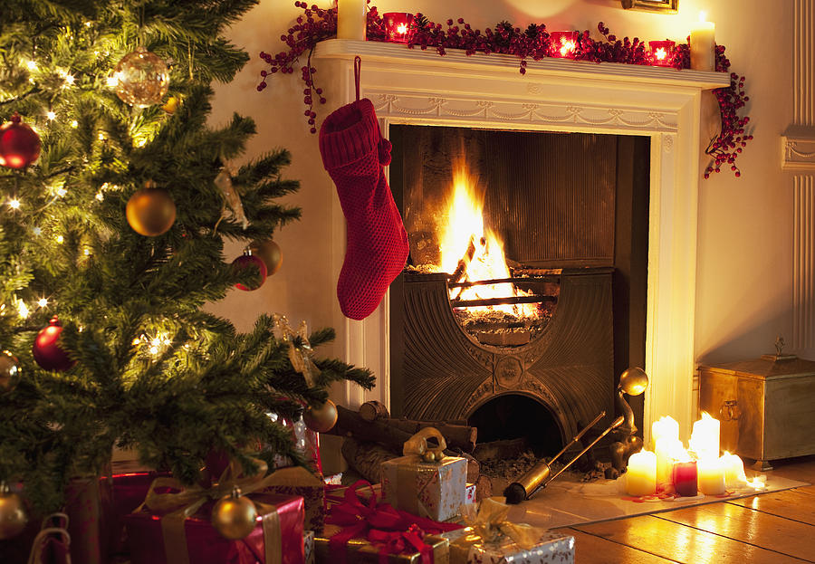 Christmas tree and stocking near fireplace Photograph by Tom Merton