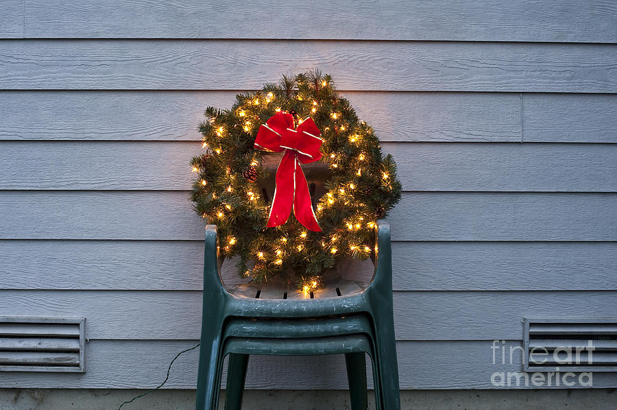 Christmas wreath on lawn chairs  Photograph by Jim Corwin