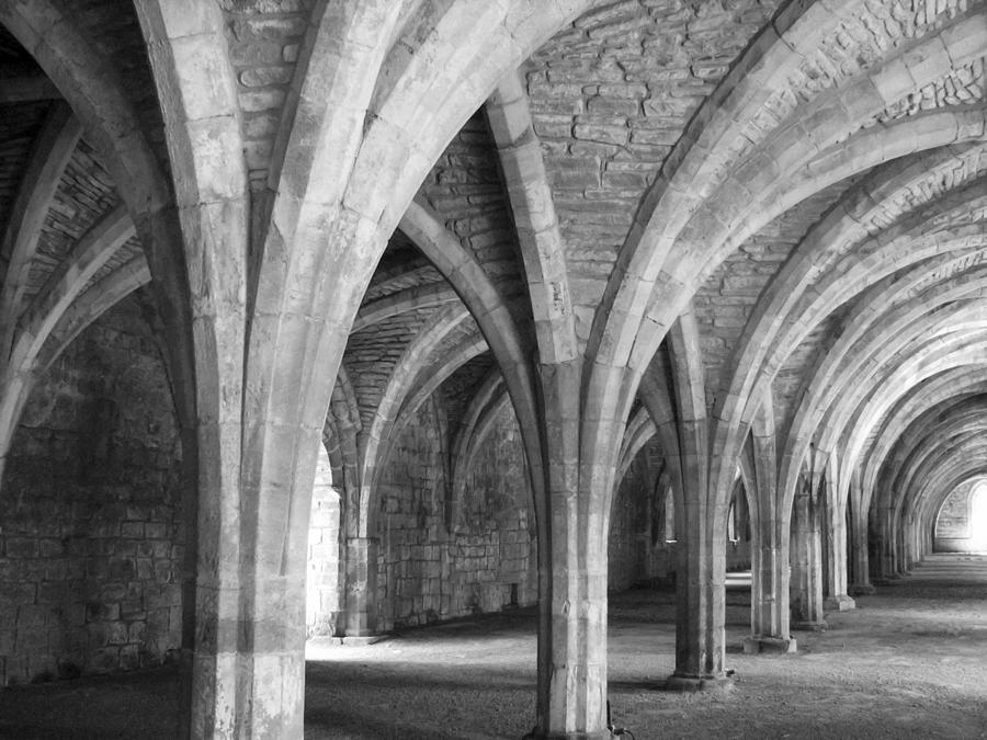 Church archways in black and white Photograph by Sue Leonard