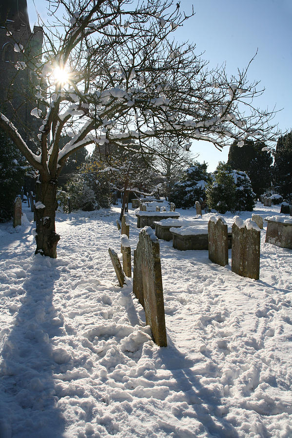 Churchyard in the Snow Photograph by John Topman