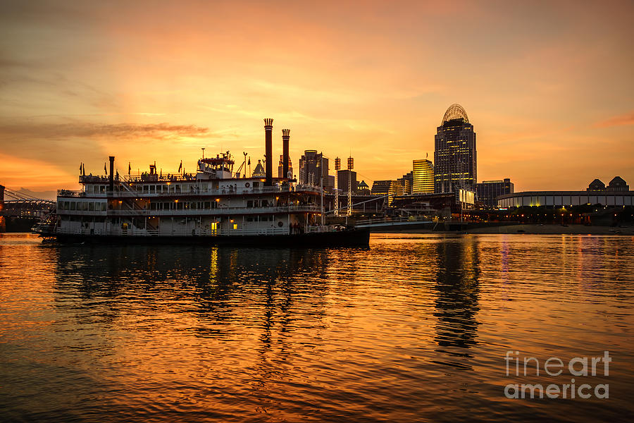 Cincinnati Skyline And Riverboat At Sunset Photograph