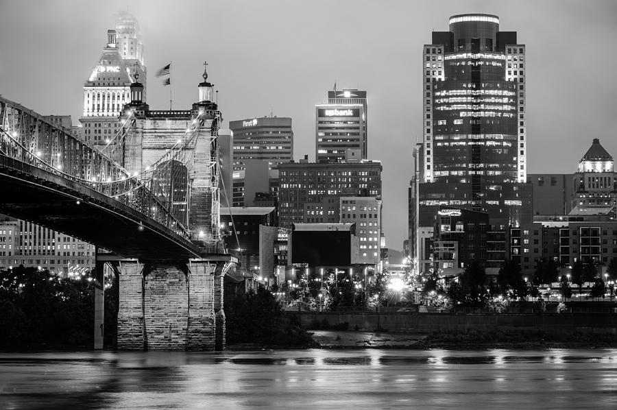 Cincinnati Skyline Photograph - Cincinnati Skyline and the John A. Roebling Suspension Bridge in Black and White by Gregory Ballos