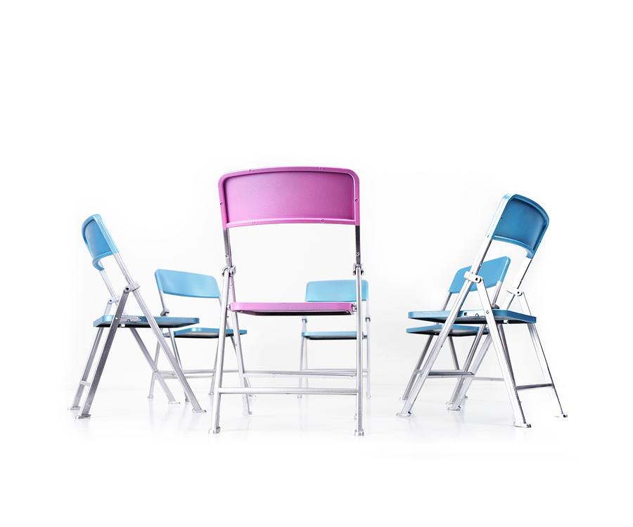 Circle Of Blue Chairs With One Pink Chair Photograph by Cordelia Molloy/science Photo Library