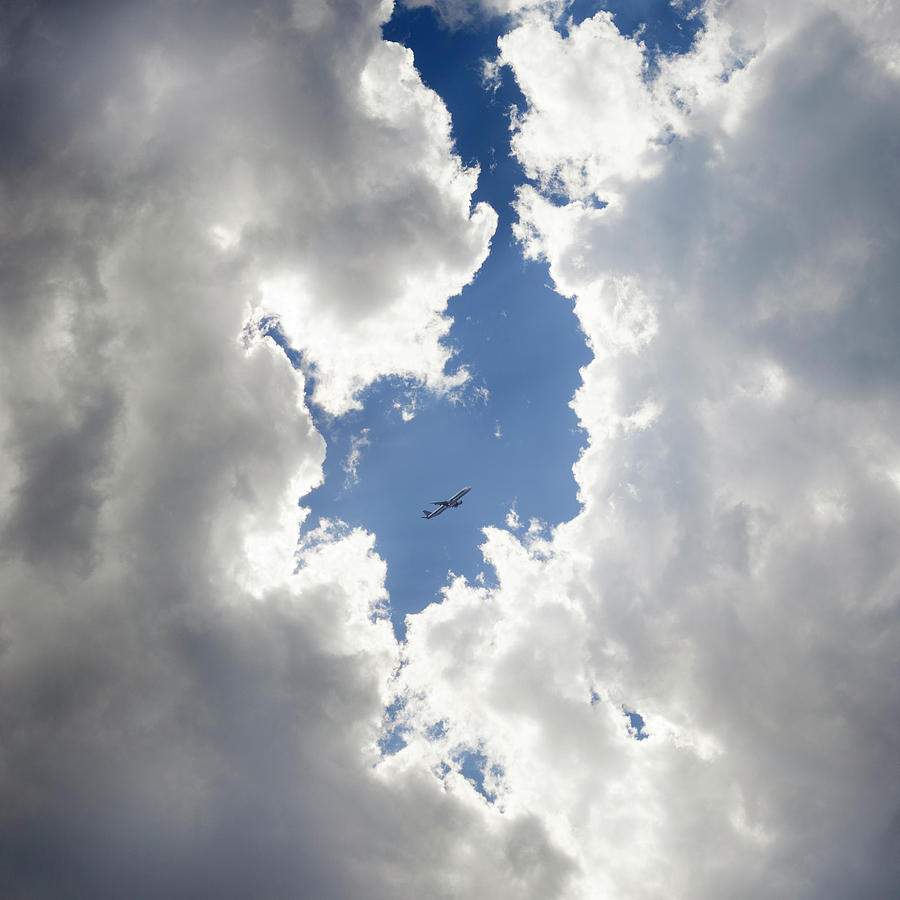 Circle Of Clouds With Airplane Photograph by Rinocdz