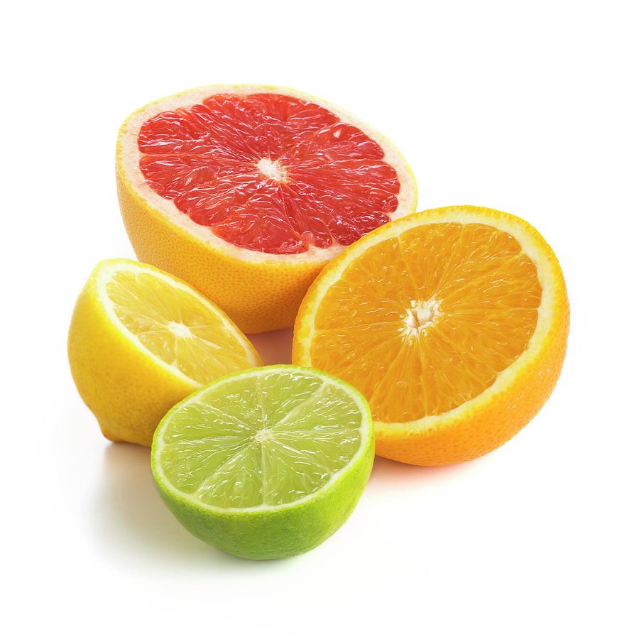 Fruit Photograph - Citrus Fruit Halves by Science Photo Library