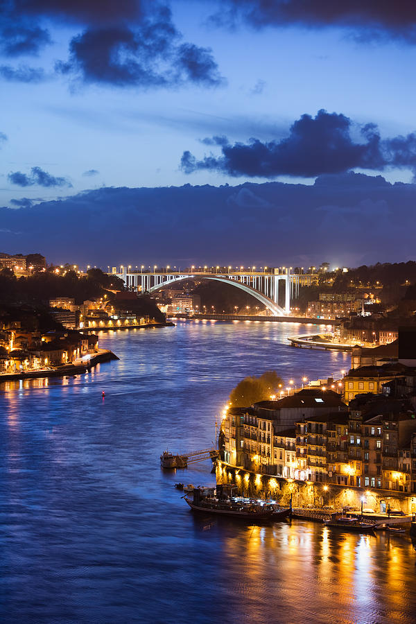 City of Porto by Douro River at Night in Portugal Photograph by Artur Bogacki