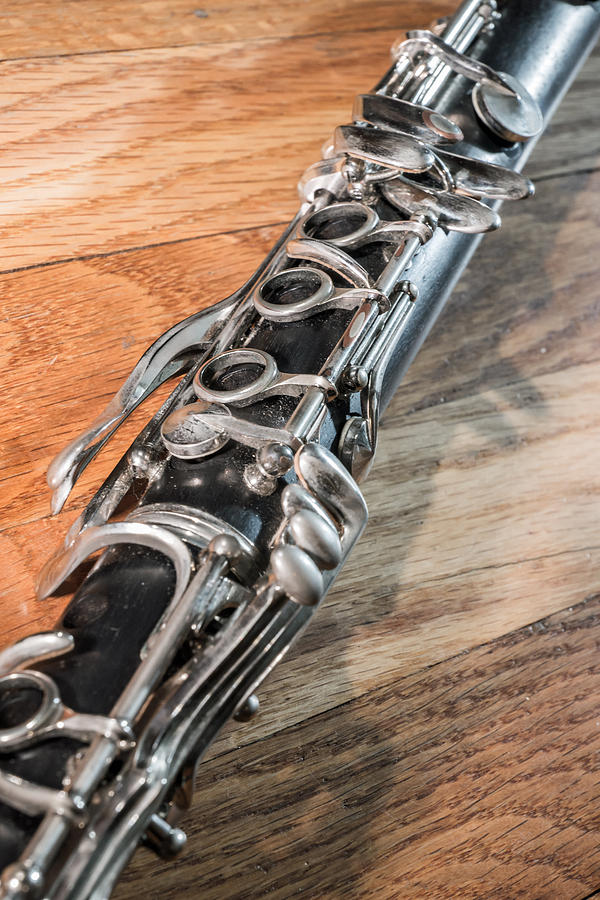 Clarinet on Two Toned Wood Photograph by Photographic Arts And Design Studio