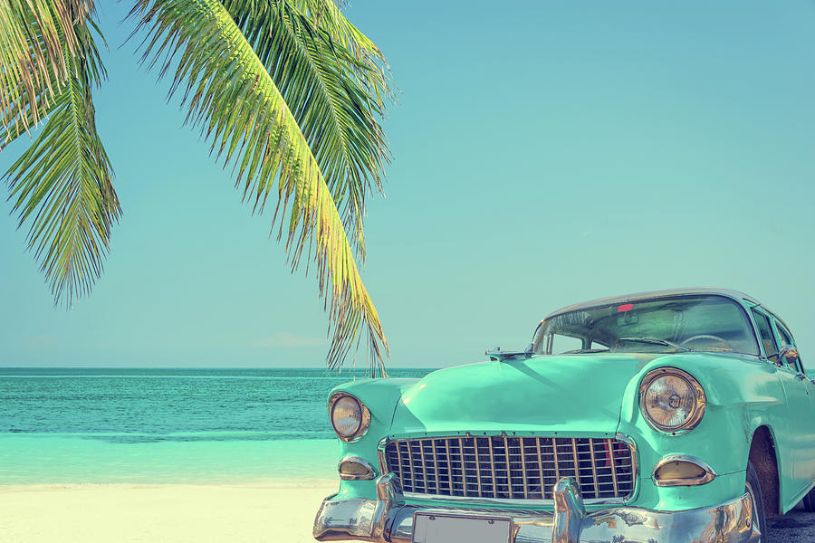 Classic Car On A Tropical Beach With by Delpixart