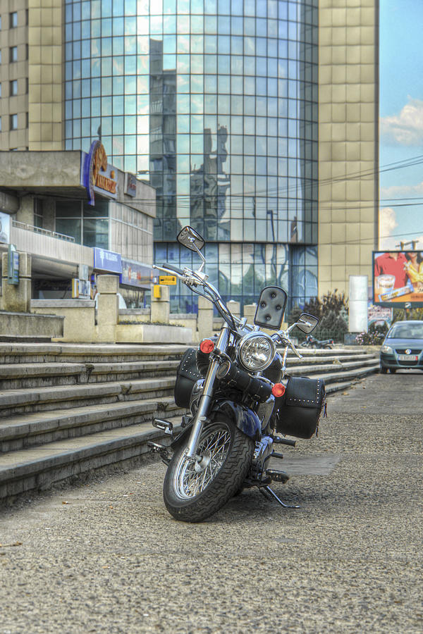 Classic Motorcycle Parked In Front Of A Modern Glass Building Photograph by Vlad Baciu