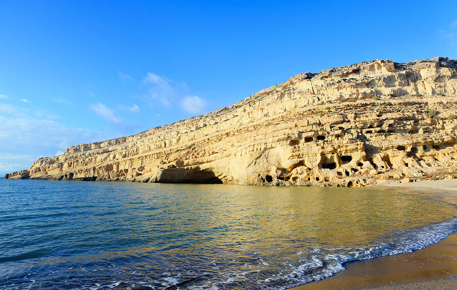 Cliffs at Matala on Crete Photograph by Paul Cowan