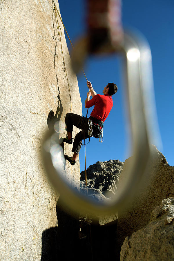 Climber Seen Through A Quickdraw Photograph By Corey Rich Fine Art America