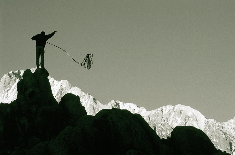 Climber Throwing Rope Photograph by Woods Wheatcroft Fine Art America